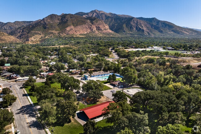 An aerial view of Loren Farr Park shows many mature trees surrounding various outdoor attraction