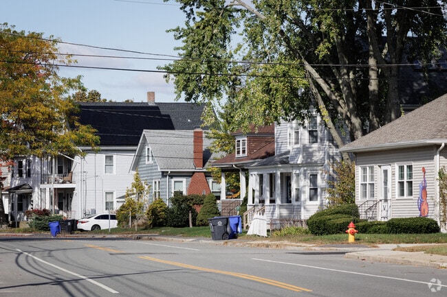 A residential street with a variety of house styles in Carpenters Corner, Rhode Island.