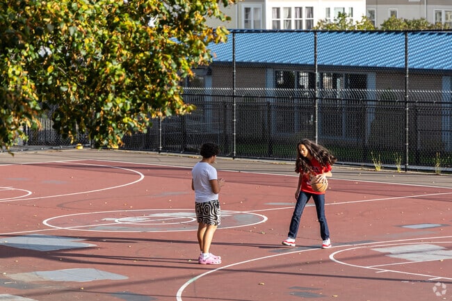 Vernon Hill Park spans 15 acres with a basketball court, pool, and open fields.