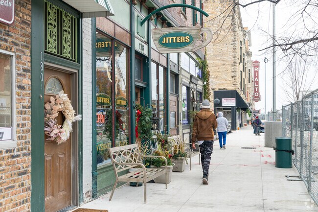 Joliet residents walk past restaurants and boutiques in the downtown area.