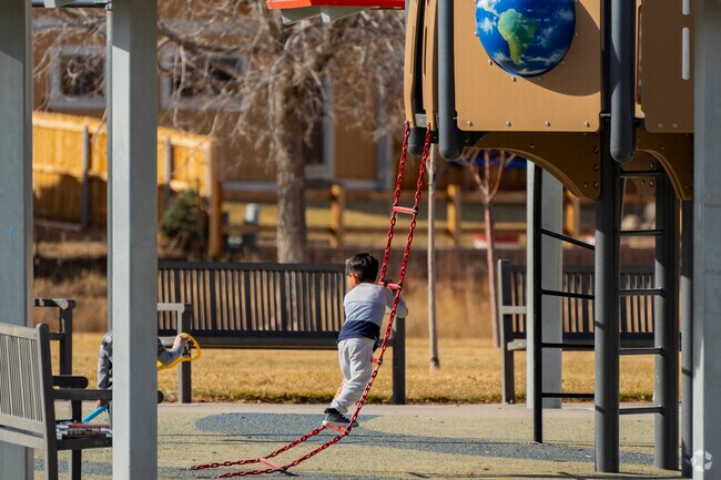 A young local plays on the jungle gym at Mission Viejo Park.
