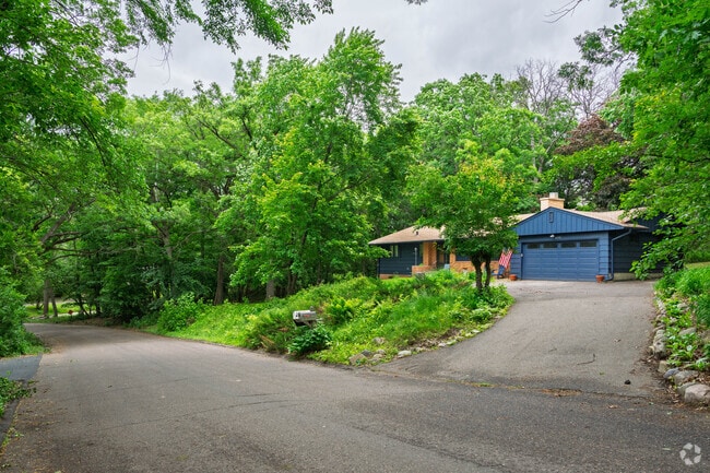 Williston features well-preserved midcentury homes with earthy tones and custom exteriors that create rustic, cottage-style appearances on half-acre lots surrounded by shaggy pines and lush foliage.