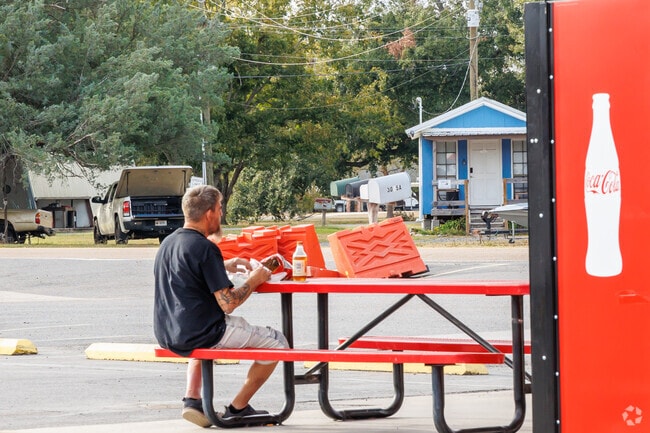 A resident enjoying a meal outside Porche's Restaurant.