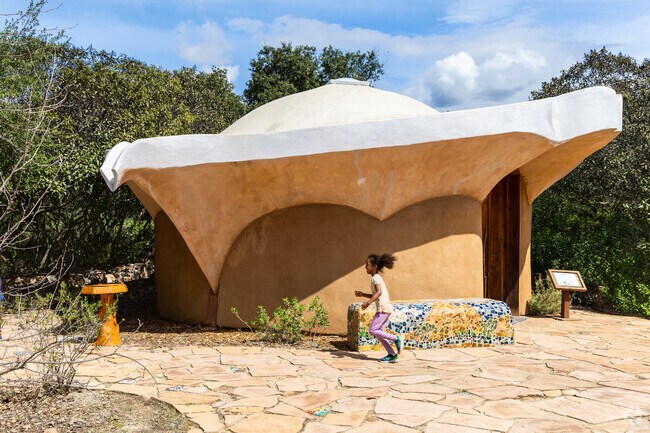 A child runs past the visitor center at Crestridge Ecological Reserve in Harbison Canyon.