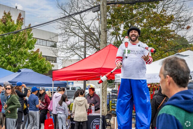Entertain yourself with some of the characters, like jugglers, at the Syosset Street Fair.