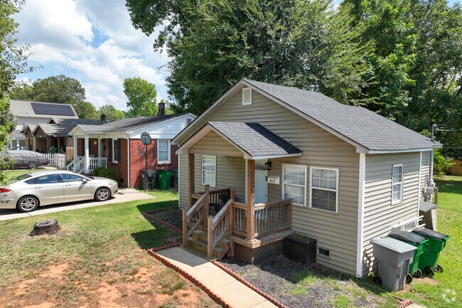 Cozy cottage homes in J. T. Williams feature a charming covered front porch for relaxing outdoors.