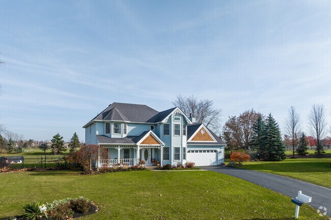 This modern home features a mix of unique architectural elements in East Amherst.