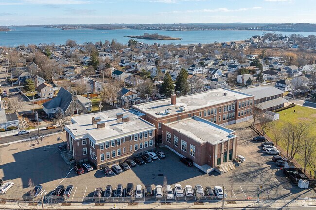 An aerial view of Atherton Hough Elementary School and the surrounding area of Quincy, MA.