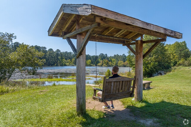 Relax on the bench swing by the pond at watch the local wildlife in Goshen.