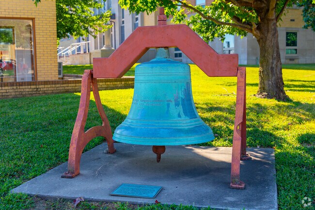 The original courthouse bell stands outside the Cherokee County Court House near downtown Columbus.