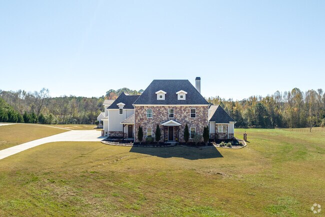 A modern French country manor adds elegance to Brooks’ rural landscape.