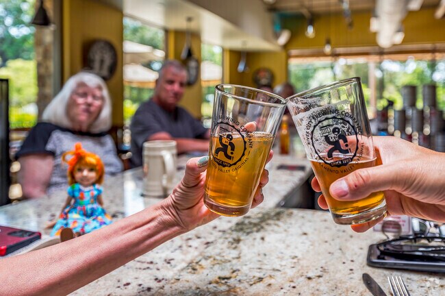 The patrons at River City Brewing Company give cheers celebrating lunch in Carmichael.