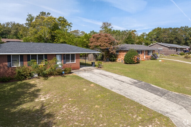 Rows of brick ranches sit back on elevated lots all around Wheeless Road.