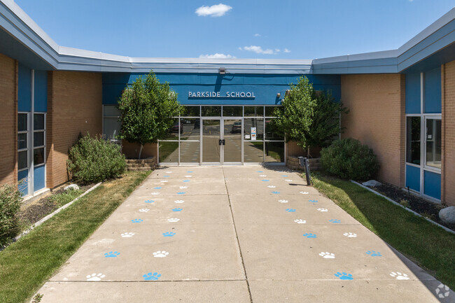 Blue details on brown brick at the front entrance at Parkside Elementary School.