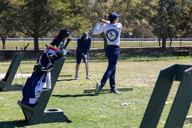 Golfers can practice their swing at Bacon Park Golf Course.
