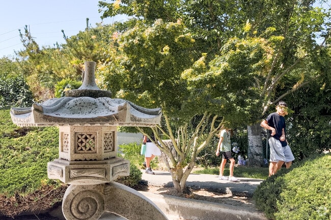 Visitors stroll through the flora of the Japanese Friendship Garden in Yerba Buena.