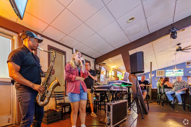 Kent Acre's karaoke at Touchdown Bar sometimes includes impromptu sax notes.