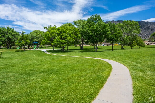 Lynnwood Park features a beautiful path and grass just minutes away from Enchanted Park.