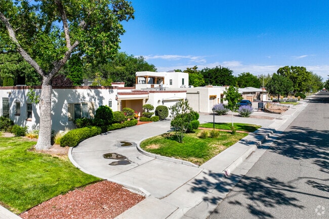 Adobe style homes with large tress are common throughout the Huning Castle area.