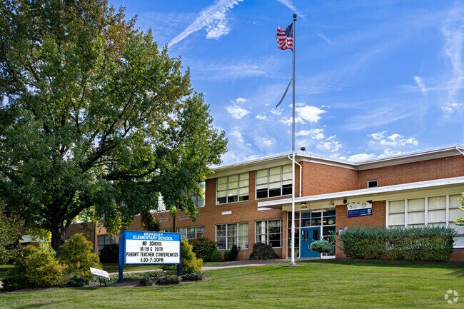 An American flag waves outside the entrance to Berkeley Elementary School in Berkeley.