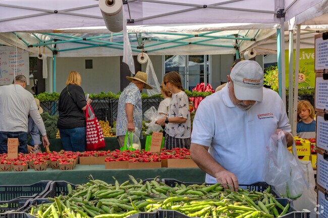 Locals come by Los Gatos Farmers Market and stock up on seasonal produce.