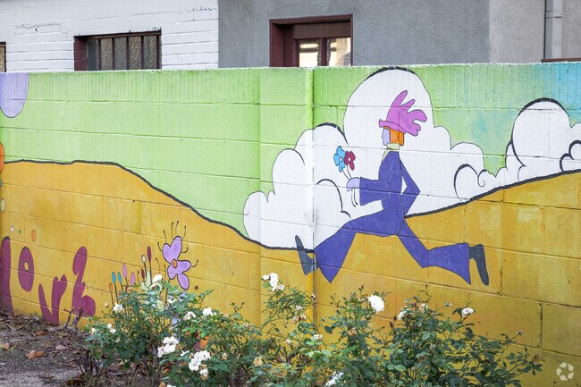 A colorful mural enlivens the neighborhood in Lower Raymond Hills.