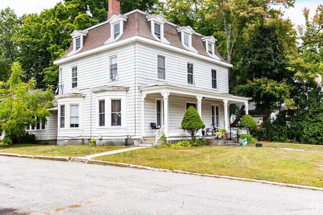 A Second-Empire-style home in North End Nashua features a mansard roof and historic charm.