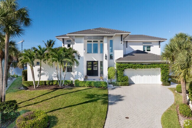 Older homes in Vanderbilt Beach are being replaced by newer more modern style homes.