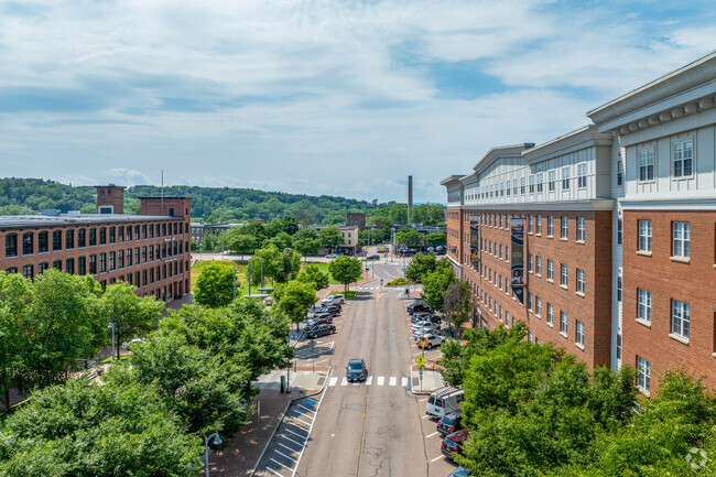 The streets of Downtown Winooski, although urban, are lined with trees.
