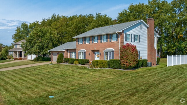 Federal-style home with a spacious yard stands in Center Township.