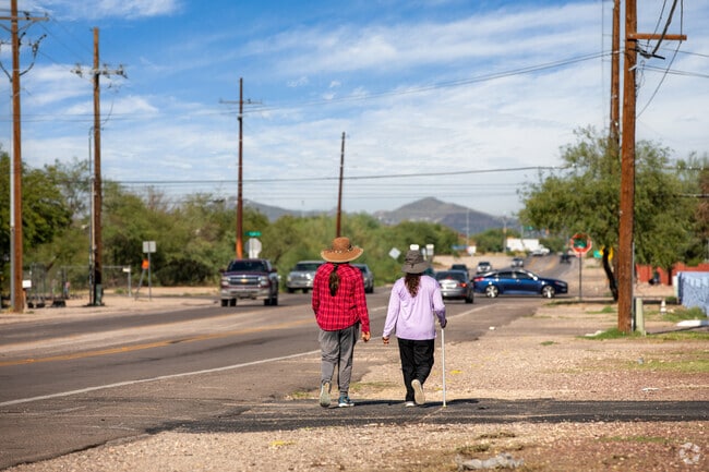 Residents of Los Ranchitos stay active by walking along Drexel Road.