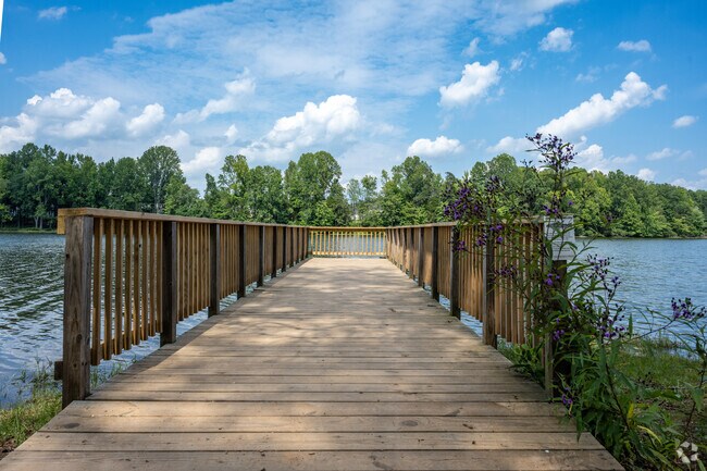 Locals enjoy the peace and serenity of the water at Lake Michael Park in Mebane.