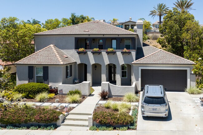 This brand new Aviara style home in La Costa Canyon has all the modern touches.