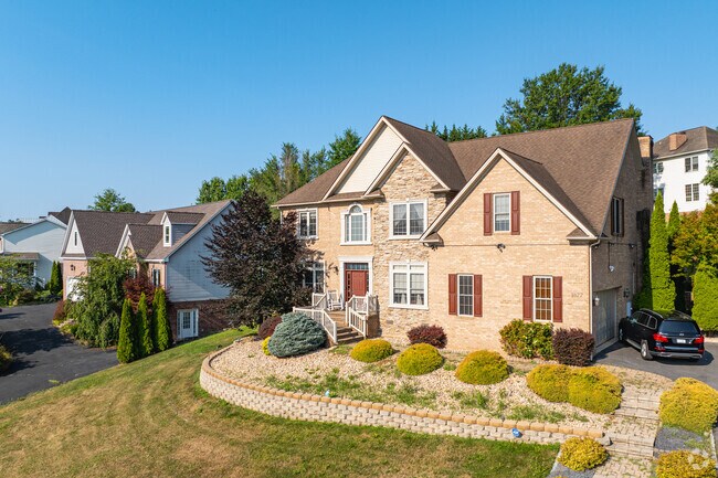 The residential streets of Harmony Hills are lined with new Traditional style homes.