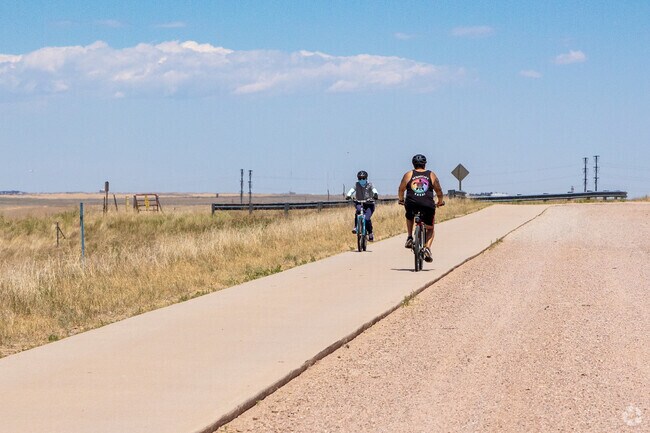 Tollgate Crossing bikers and joggers enjoy miles of paved trails at the Aurora Reservoir.