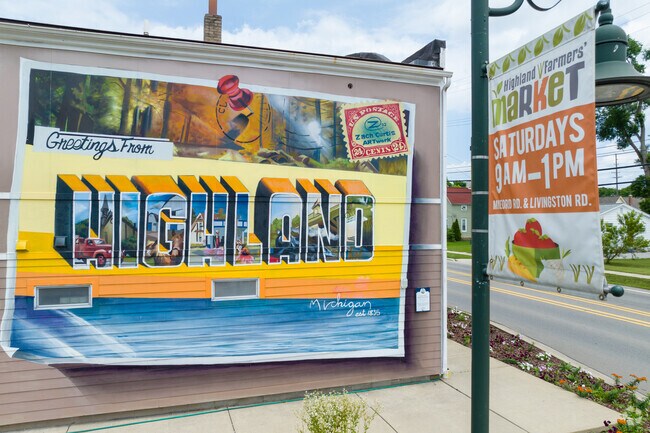Colorful wall art created by Zach Curtis welcomes visitors to Highland Charter's Downtown.