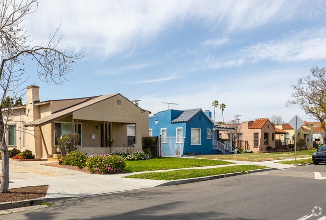 Manchester Square features colorful homes with vintage charm and stucco exteriors.