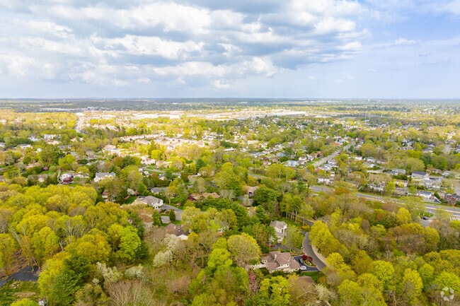 Muttontown residents enjoy living in the luxurious lush landscapes of rural New York.