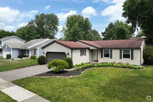 Ranch style homes can be found in the quiet suburban neighborhood of Olentangy High Bluffs.