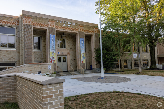 The entrance of Viola L. Sickles School features ornate architectural details.