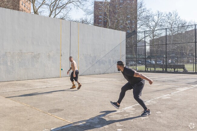 Friends meet up to play handball at a Marble Hill playground near Kingsbridge.