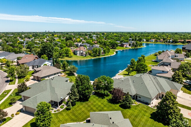Bluemont Lakes from above showcases a tranquil neighborhood surrounded by scenic lakes.