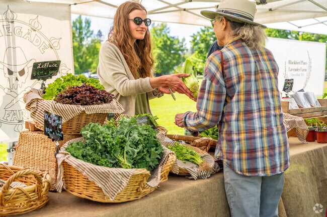 Locals come to the Thursday Market for fresh produce in their neighborhood.