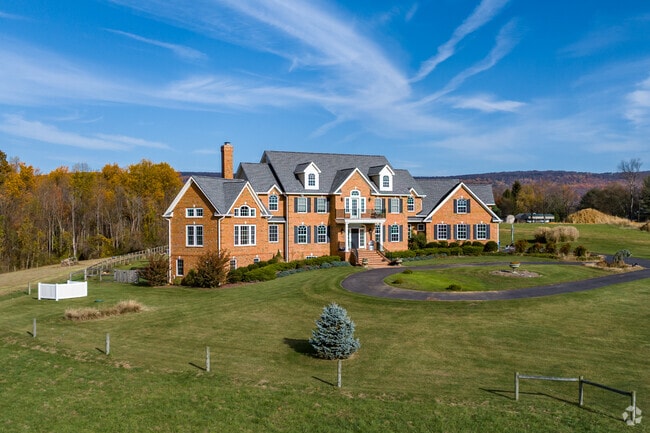 Opulent brick colonial home on an estate-sized lot with exceptional Braddock Heights views.