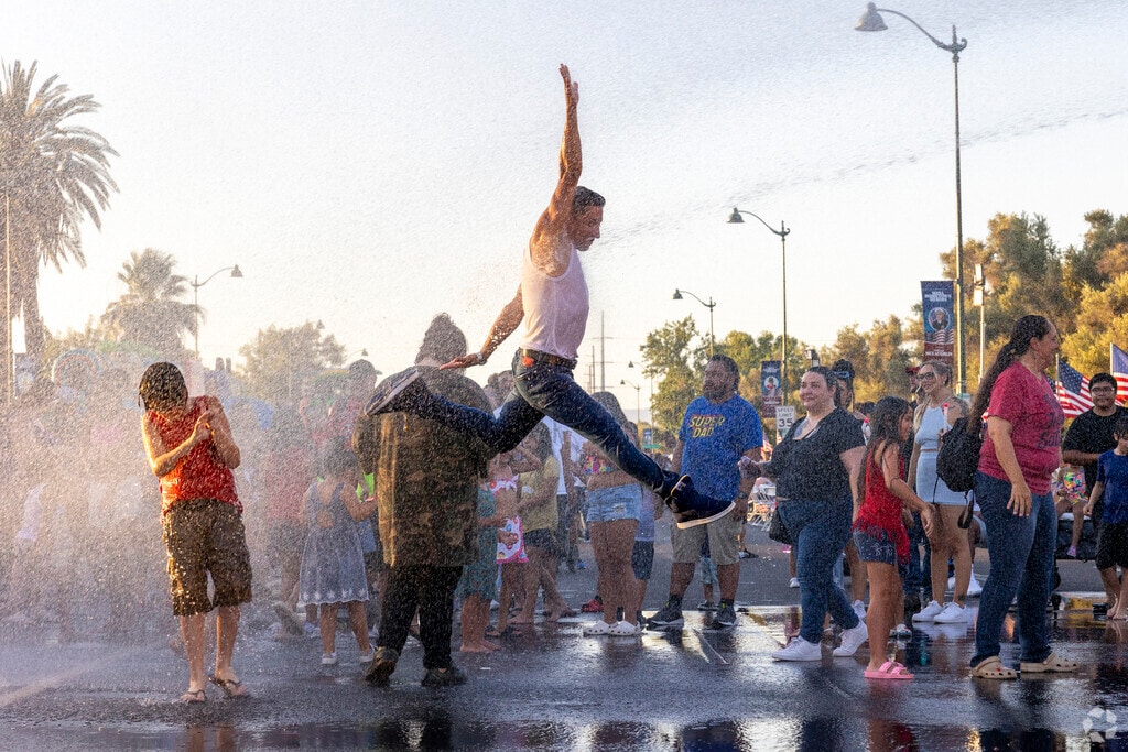 Cool off in the fountain at Mesa’s Arizona Celebration of Freedom.