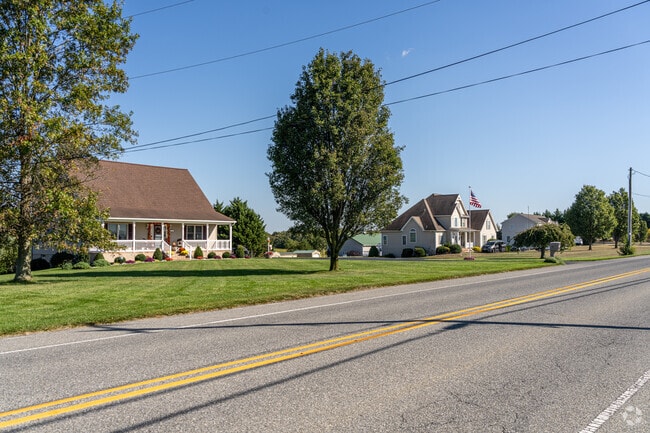 A bungalow sits next to its more modern neighbor along Sewall Rd in Hopewell Township.