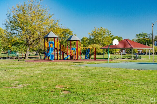 A playground next to a basketball court can be found near the main entrance of Fairground Park.