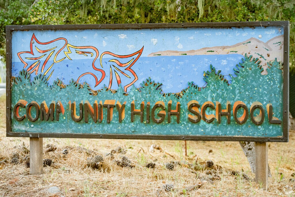 Community High School sign at Pacific Grove Community High School in Pacific Grove, California.