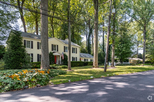 A charming row of colonial inspired homes in Manor Park.