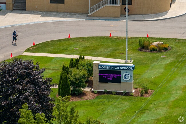 Homer Senior High School's main sign is electronic and informative.